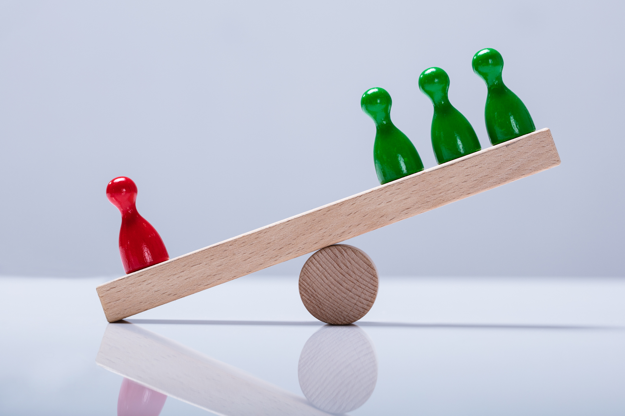 Pawns on a seesaw