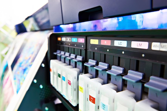 Color ink cartridges in a printer.