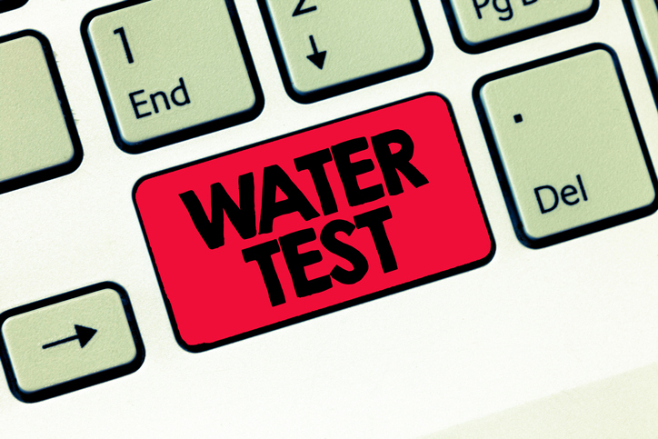 A red "water test" key on a keyboard.