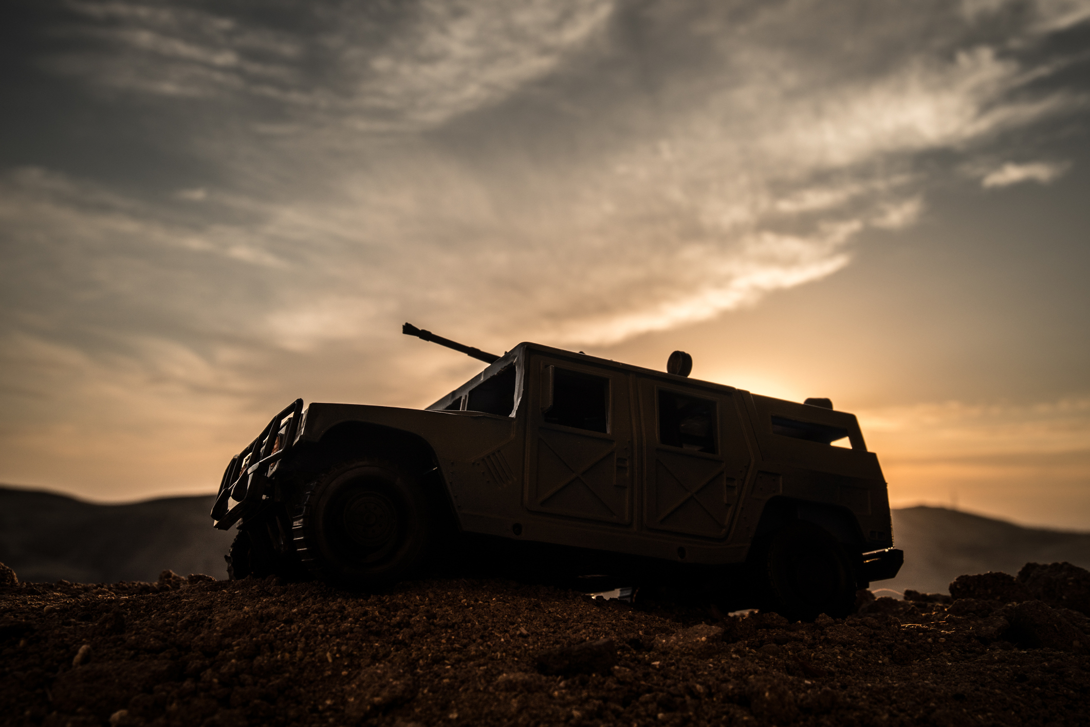 A military vehicle in silhouette