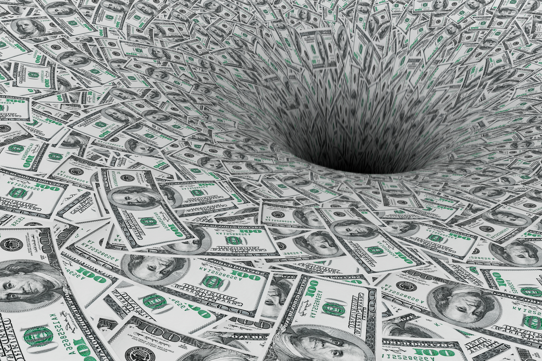 Hundred-dollar bills swirling down into a hole.
