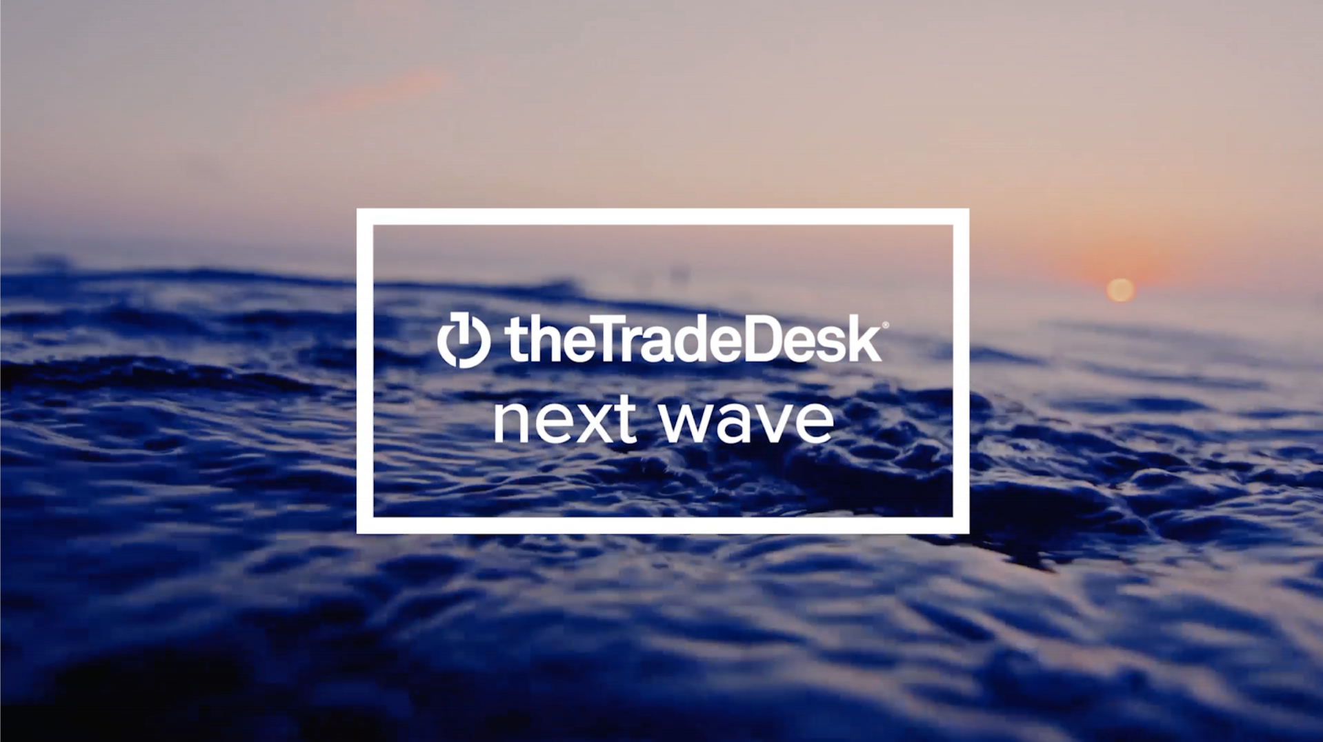 The Trade Desk logo and marketing saying, The Next Wave.