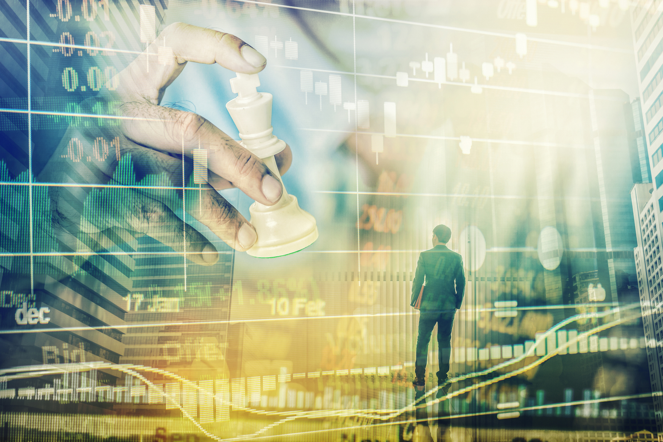 A person looking at a giant hand moving a chess piece, with a stock chart in the background