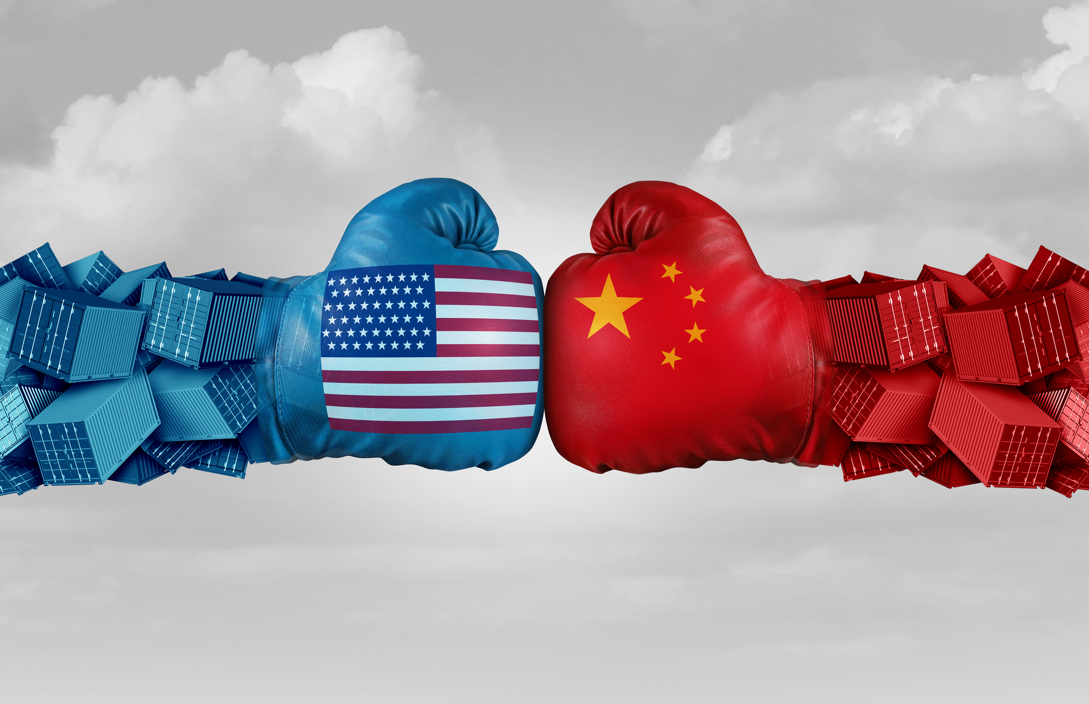 Two boxing gloves, one with the U.S. flag painted on it, one with the China flag painted on it, touch.