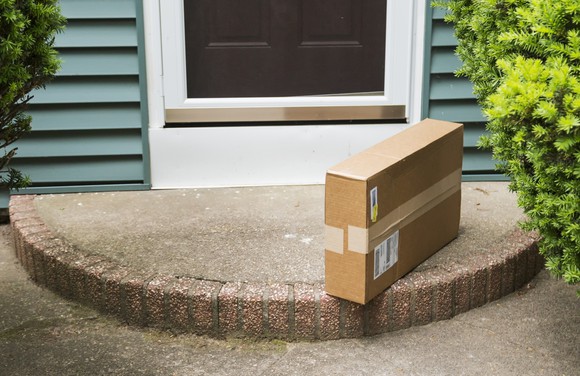 A package sitting on a doorstep.