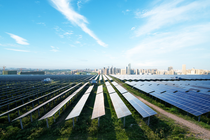 A solar facility outside a city.