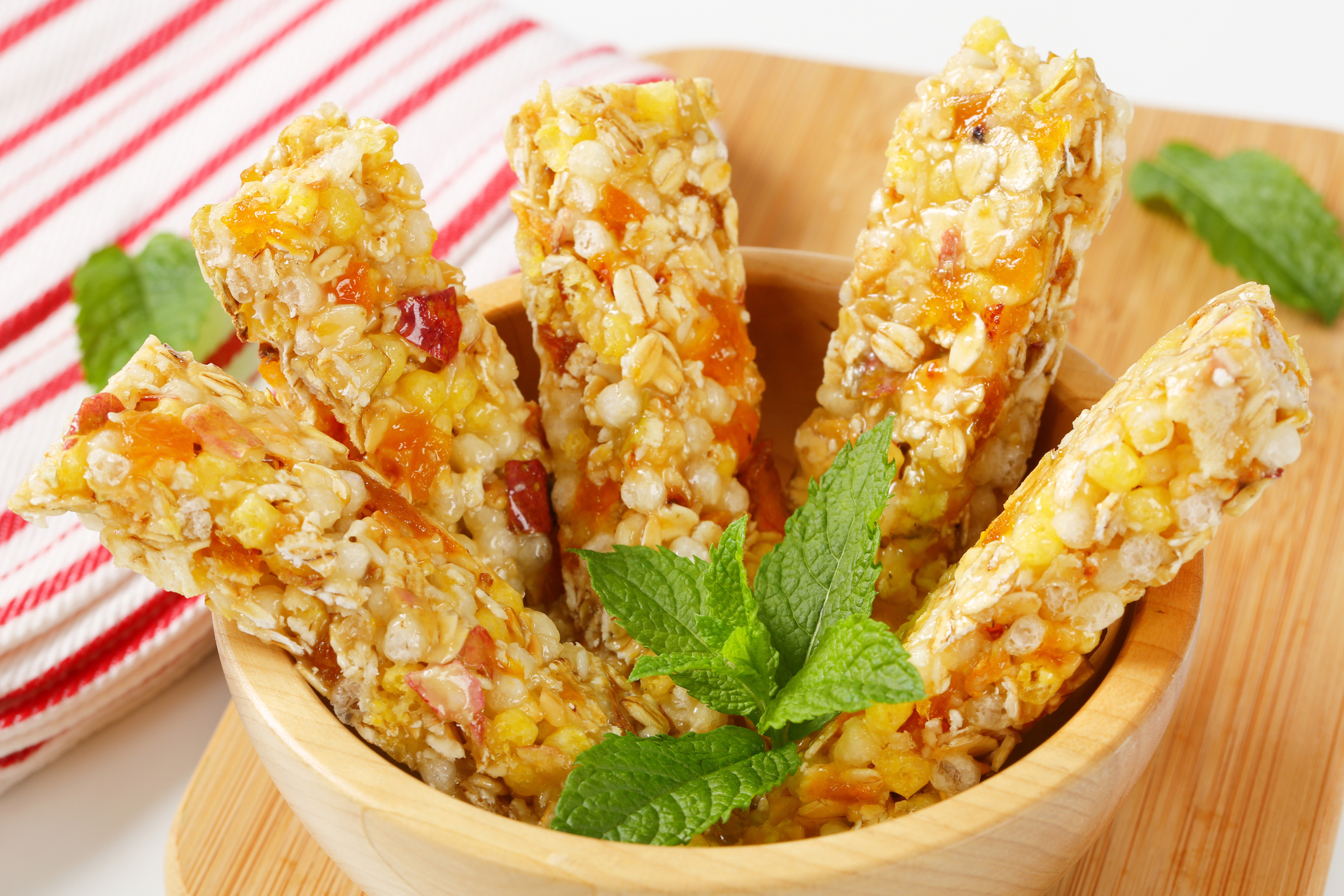 Apricot and apple cereal bars in a bowl.