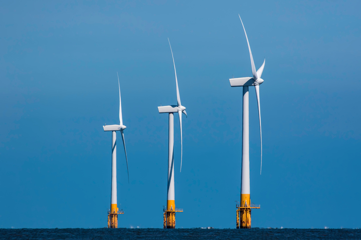 Three offshore wind turbines.