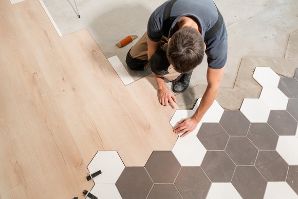 Man installing flooring