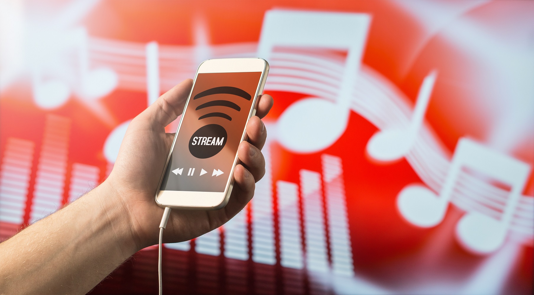Smartphone with music streaming app. In the background are white musical notes against a red backdrop.