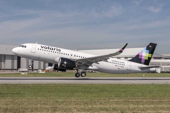 A Volaris plane taking off from a runway