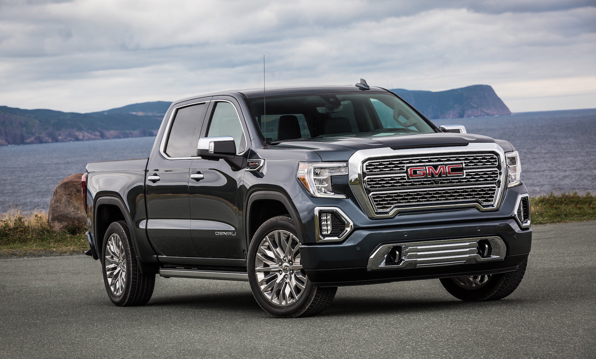 A black 2019 GMC Sierra Denali, a full-size light-duty crew-cab pickup truck.