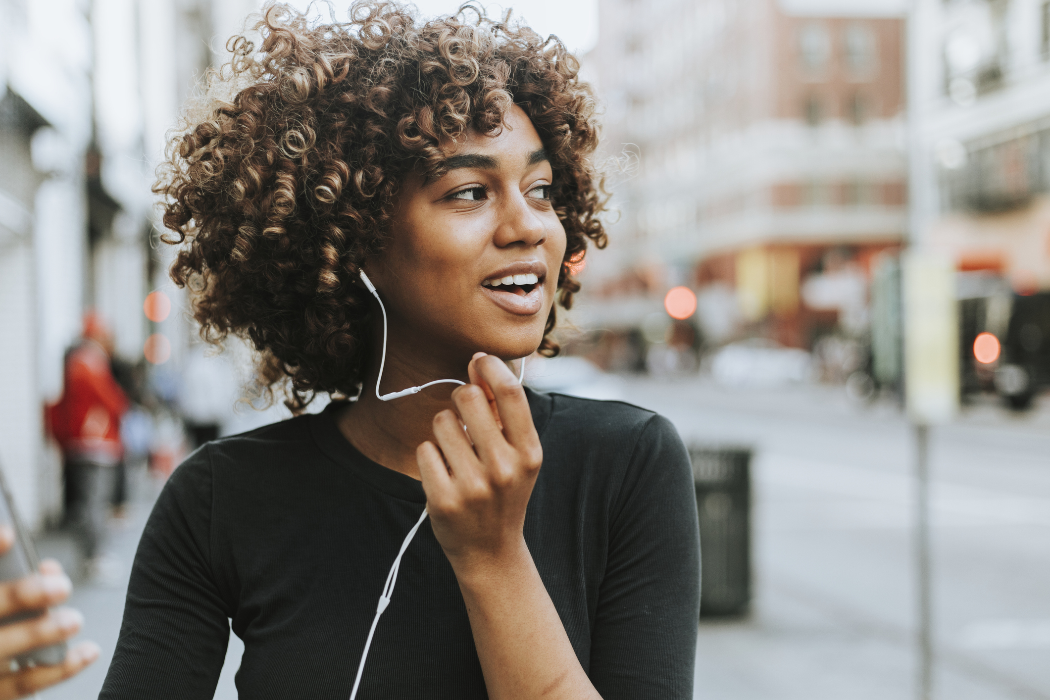 A woman with headphones.