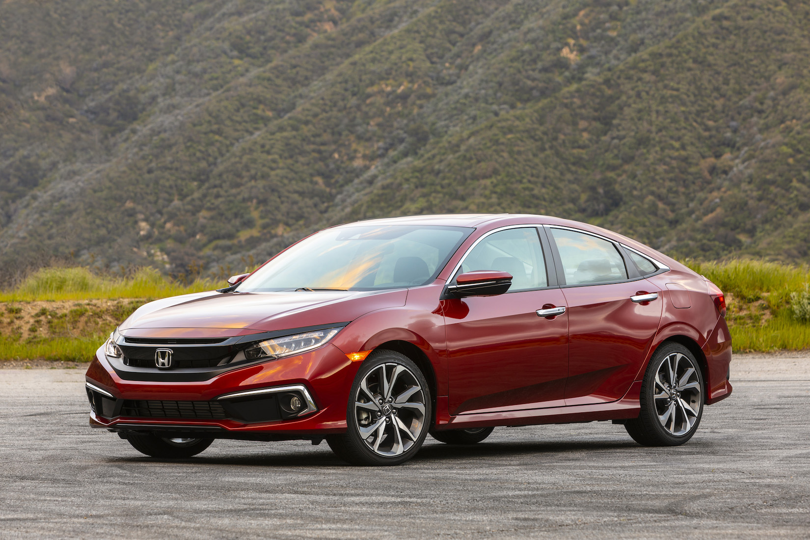A red 2019 Honda Civic, a compact sedan.