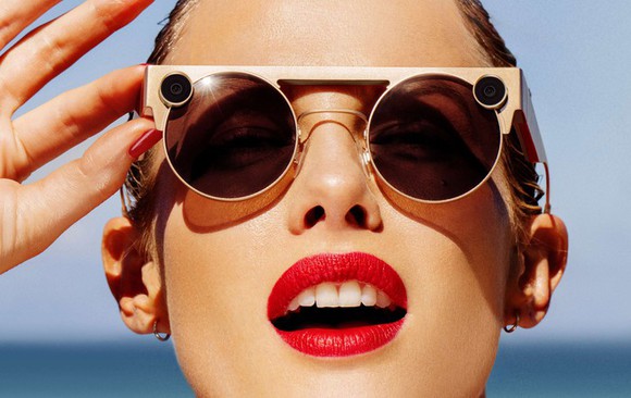 A woman wearing Snap spectacles