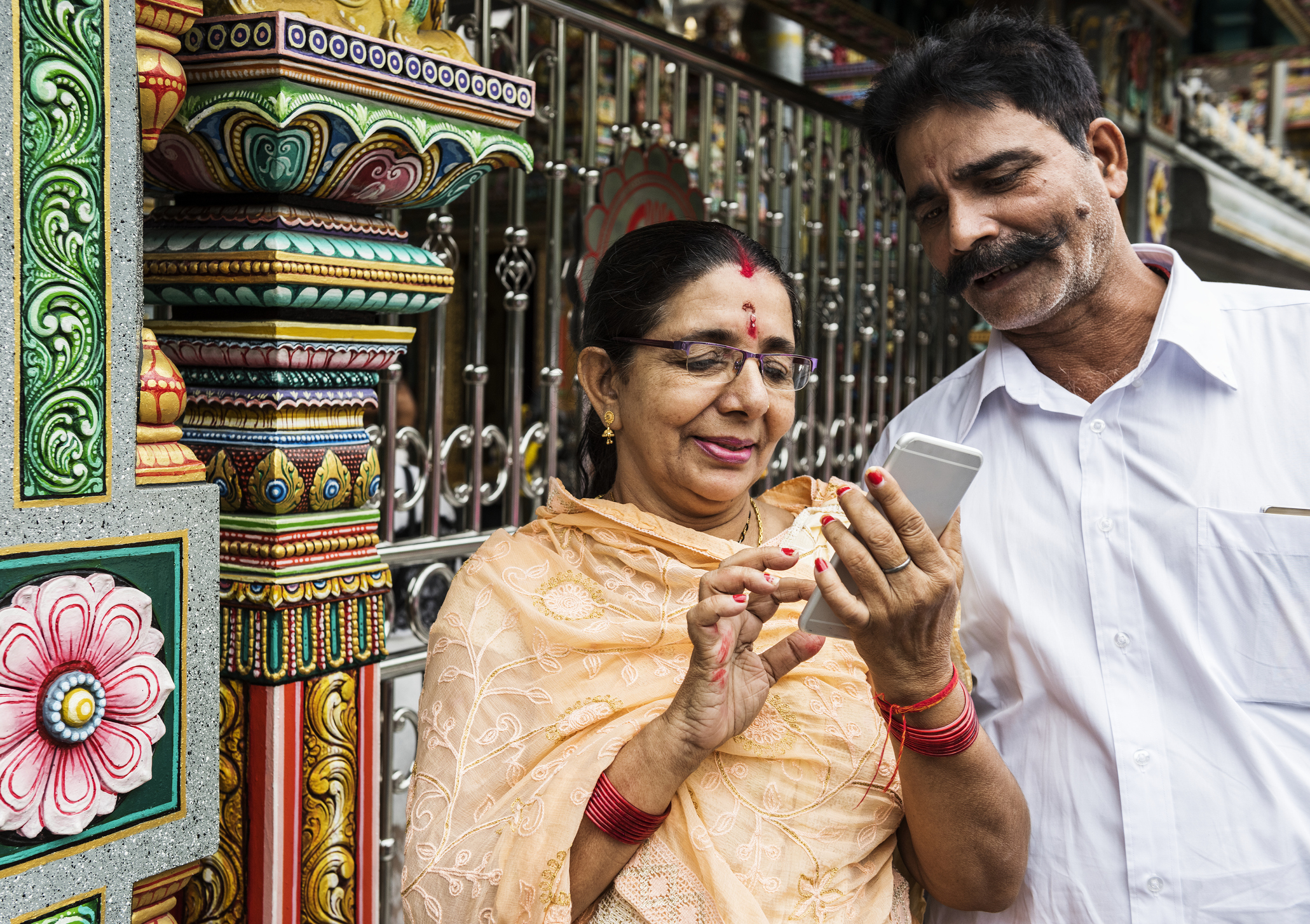 Indian couple using a smartphone