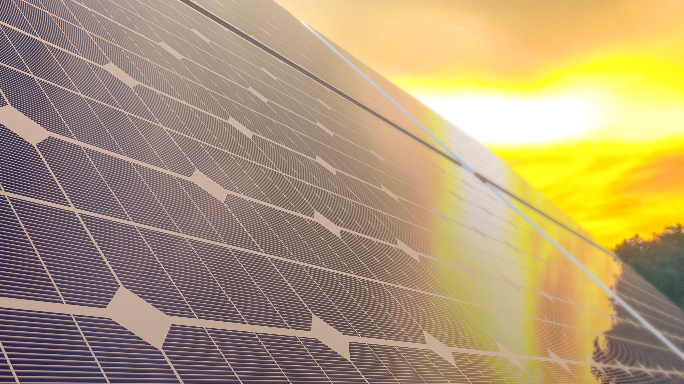Solar panel with sun in the background
