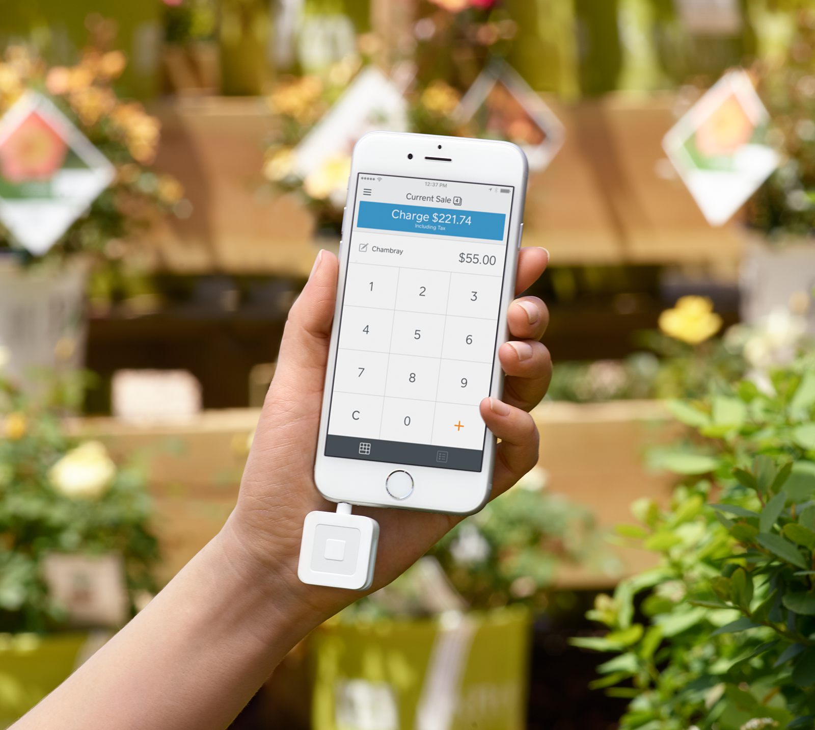 Square's mobile card reader attached to a smartphone.
