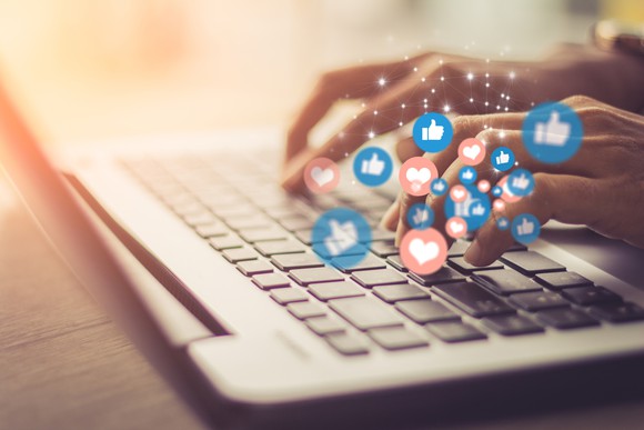 Typing up likes and hearts on a keyboard