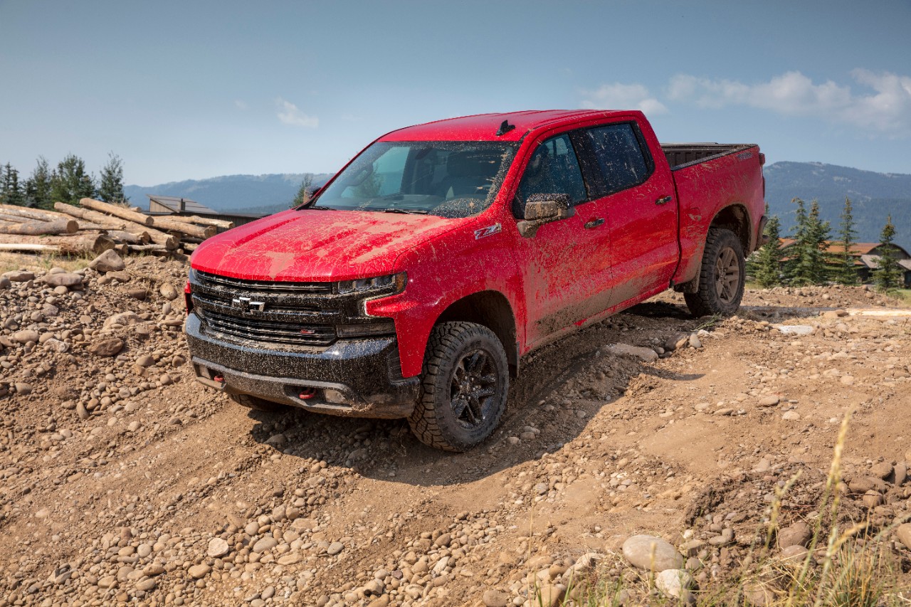 The 2019 Chevrolet LT Trail Boss coming up over a dirt hill.