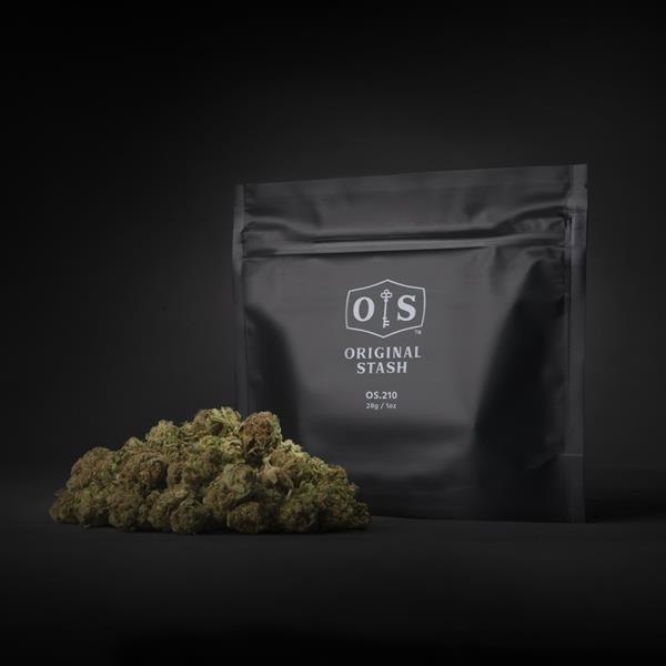 A pile of cannabis buds next to a black bag with HEXO's Original Stash logo.