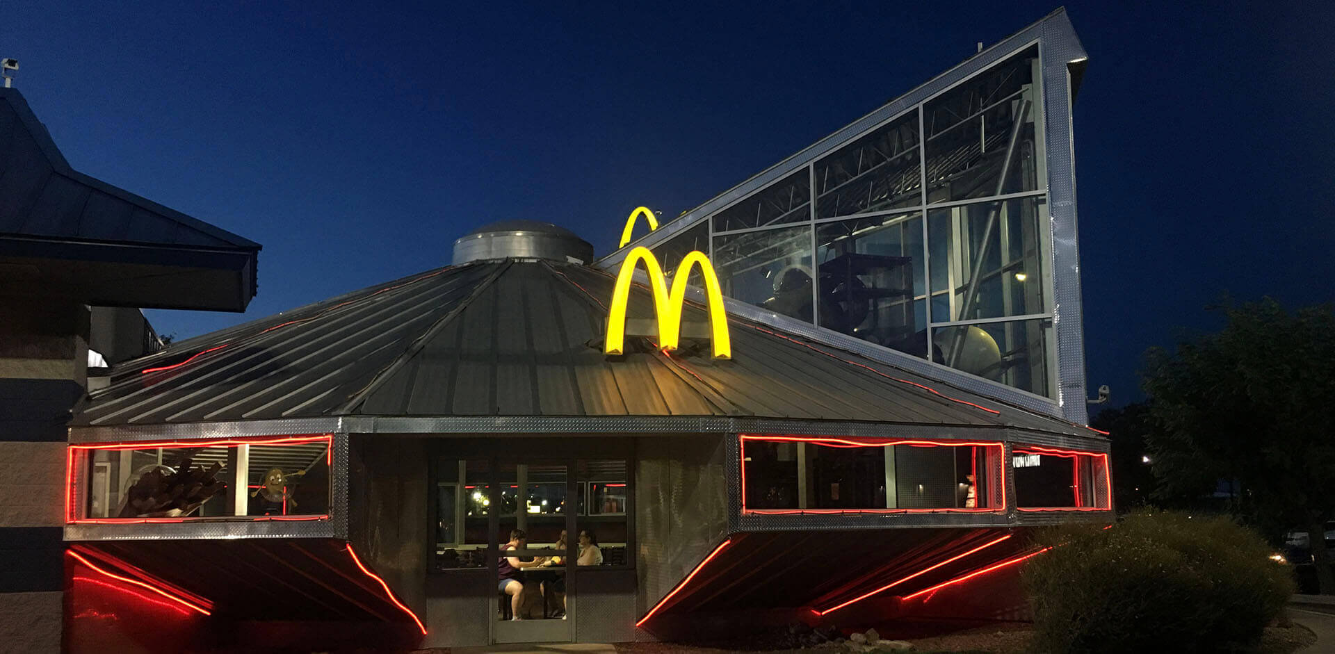 McDonald's location at dusk with metal framing.