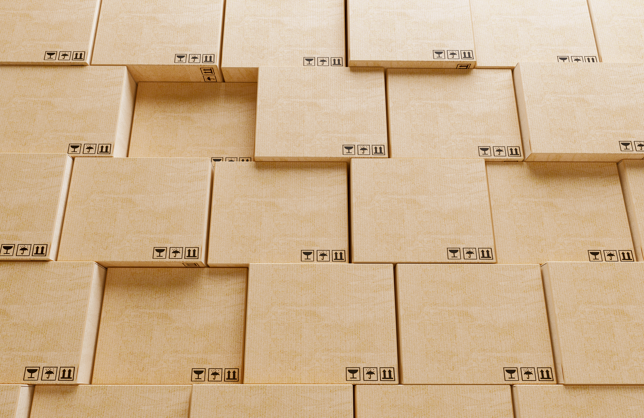 A wall of shipping boxes stacked to resemble a Jenga puzzle.