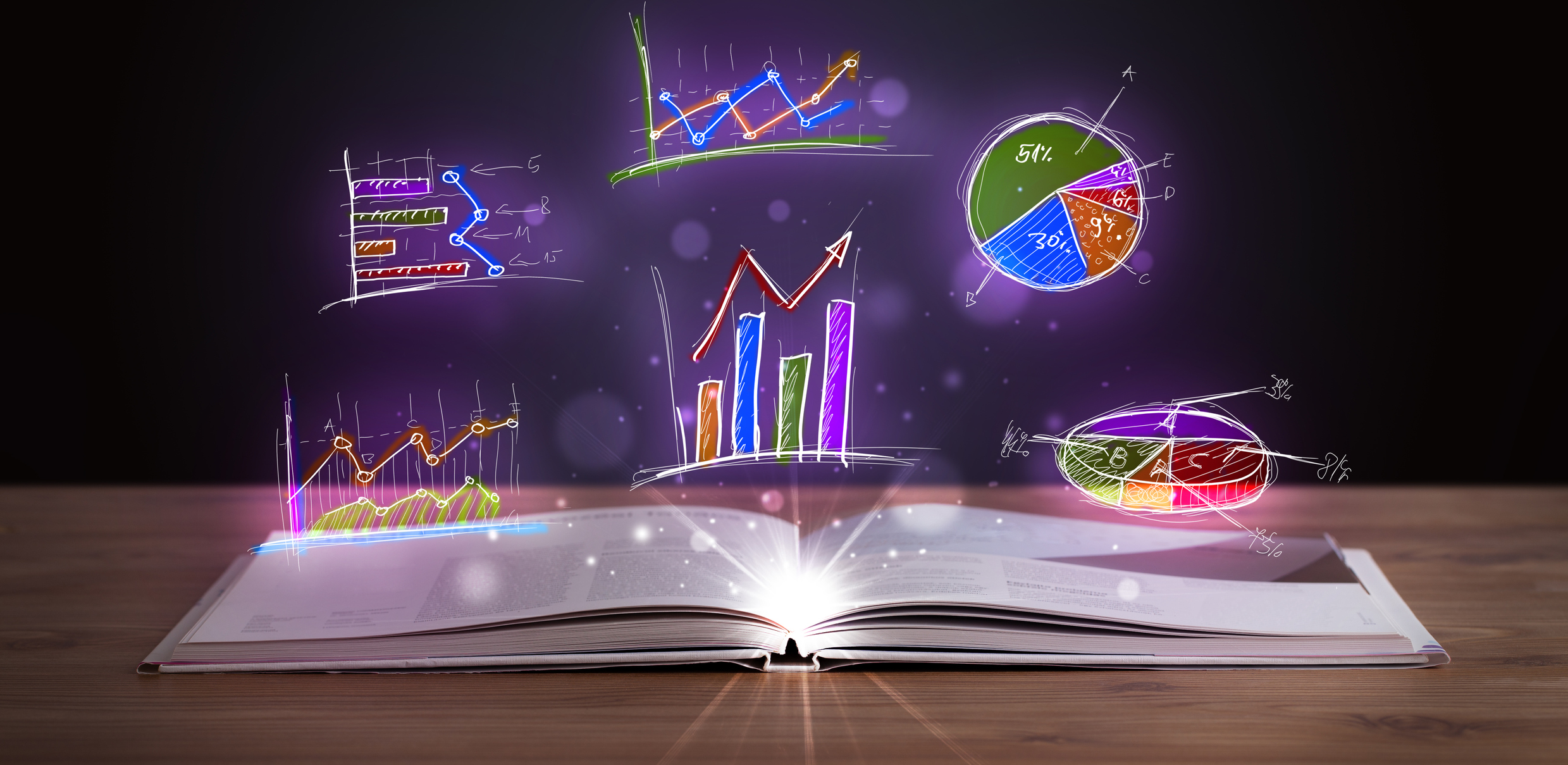 Open book with images of charts appearing above it