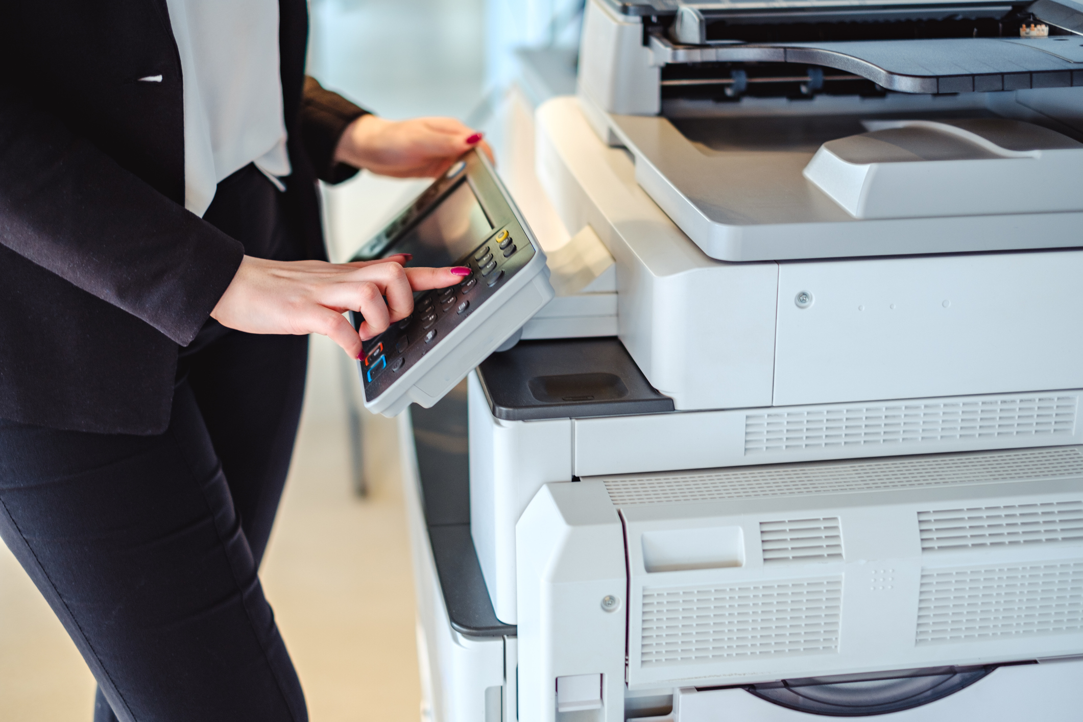 Person using a paper copier