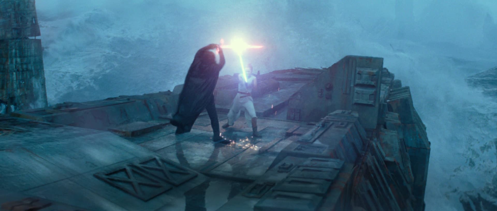 Rey and Kylo Ren having a lightsaber battle.