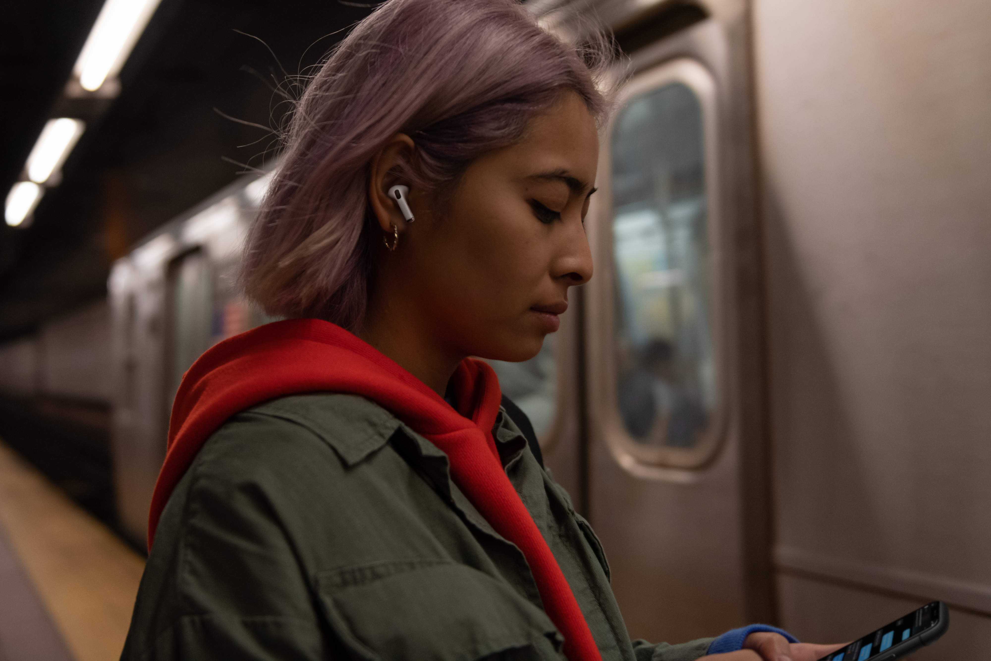 A woman wearing Apple's AirPods Pro
