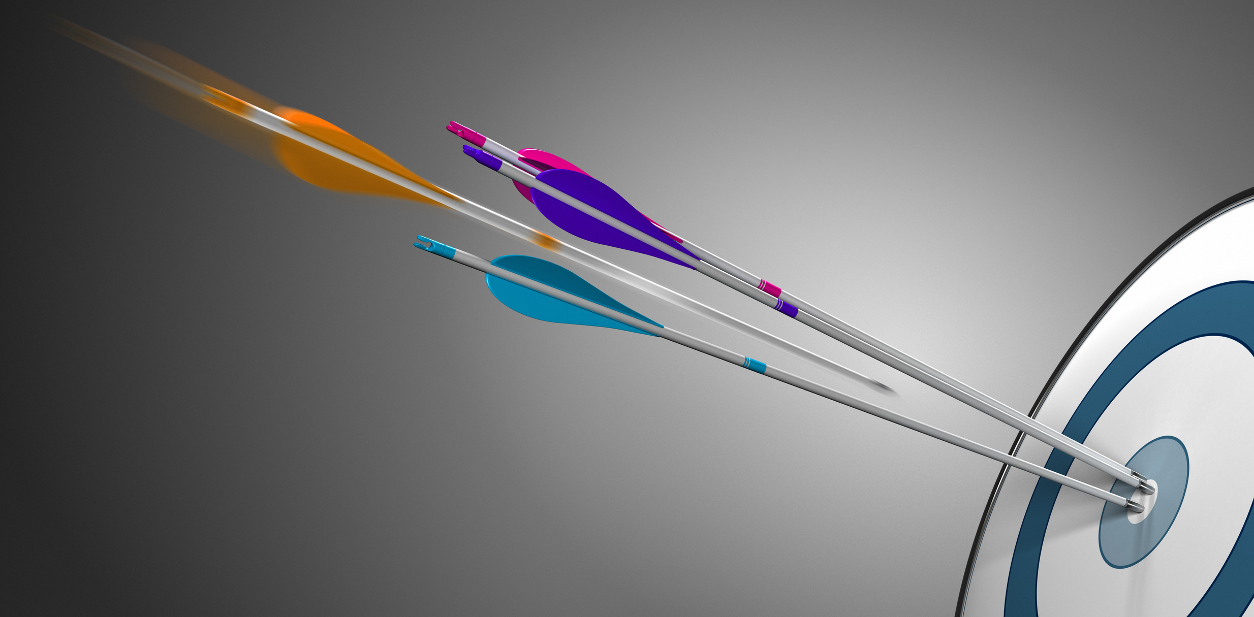 Several arrows hitting the bullseye in a single archery target.