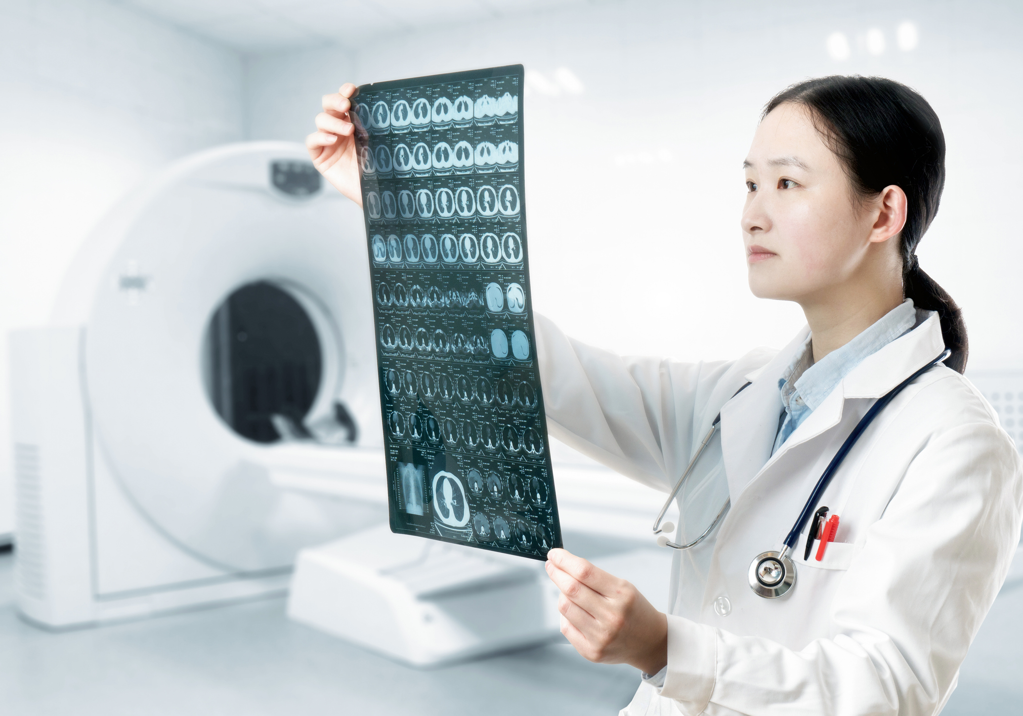 A doctor reviewing brain scans