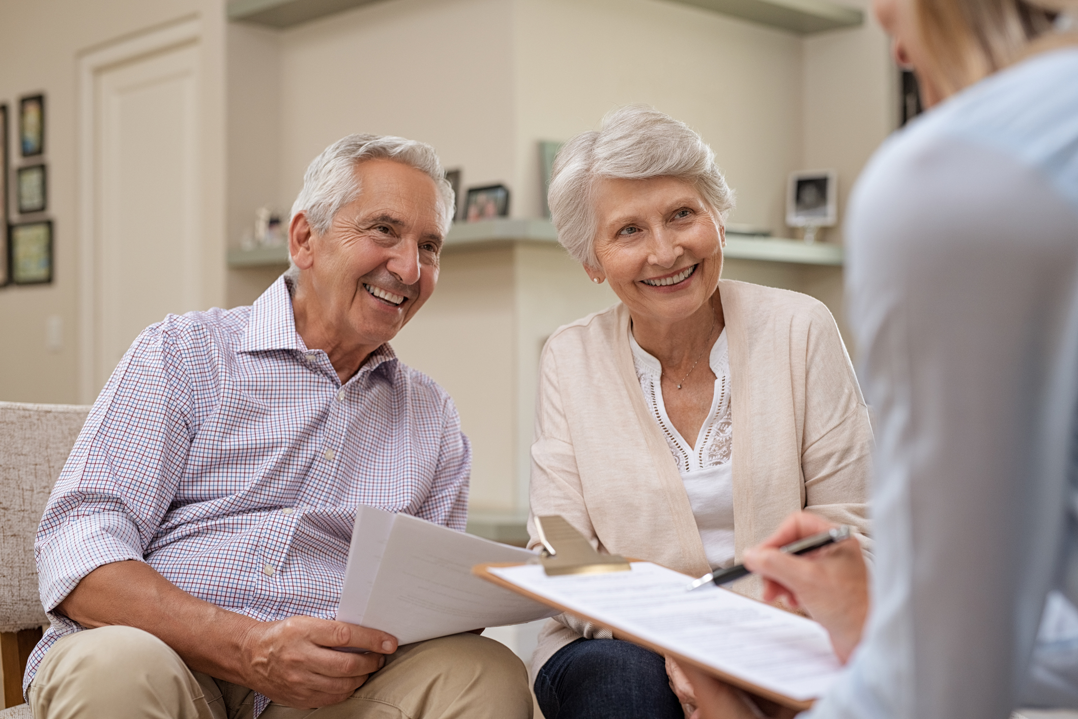 Mature couple signing up for health insurance.