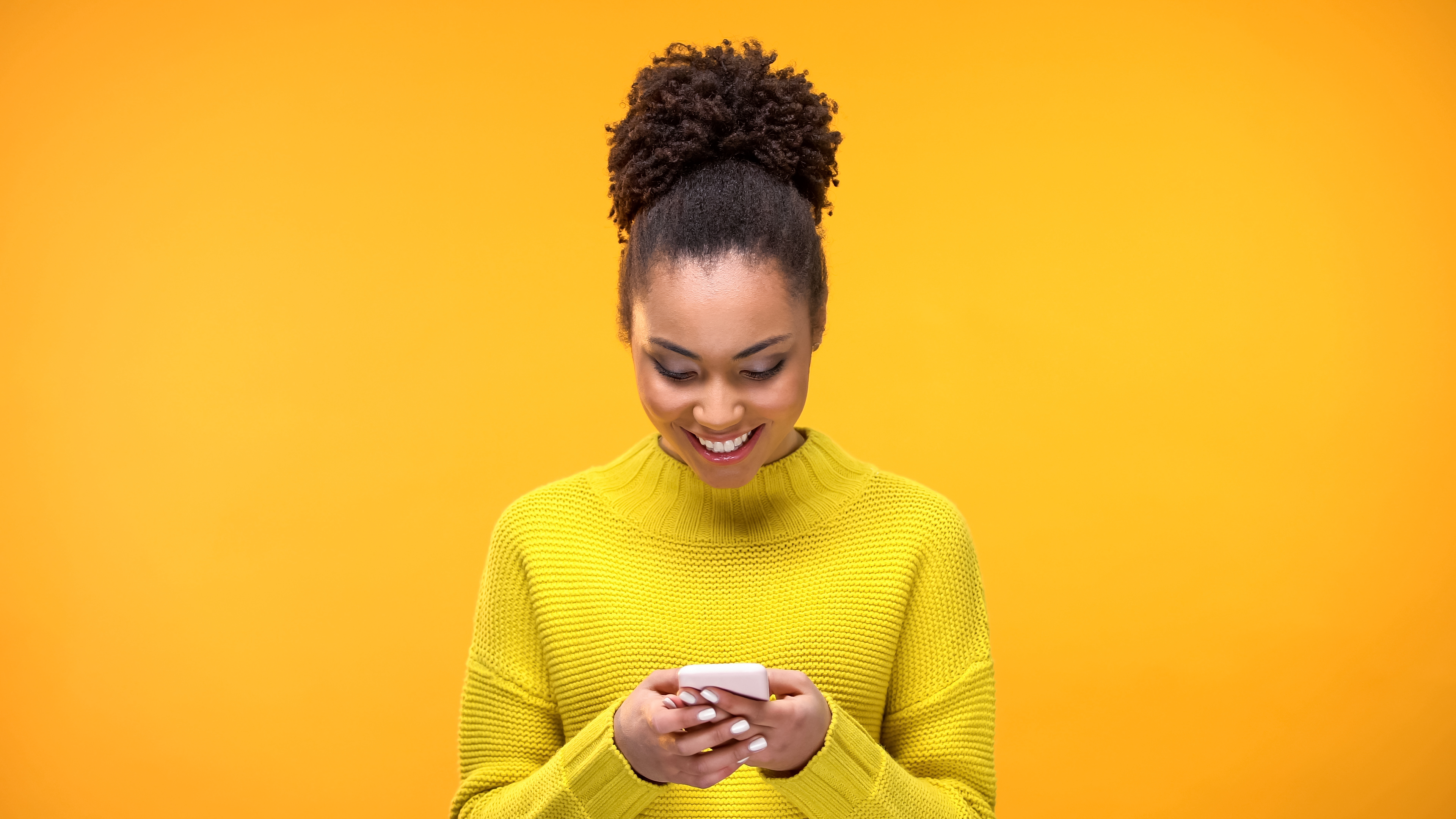 A woman looking at her phone