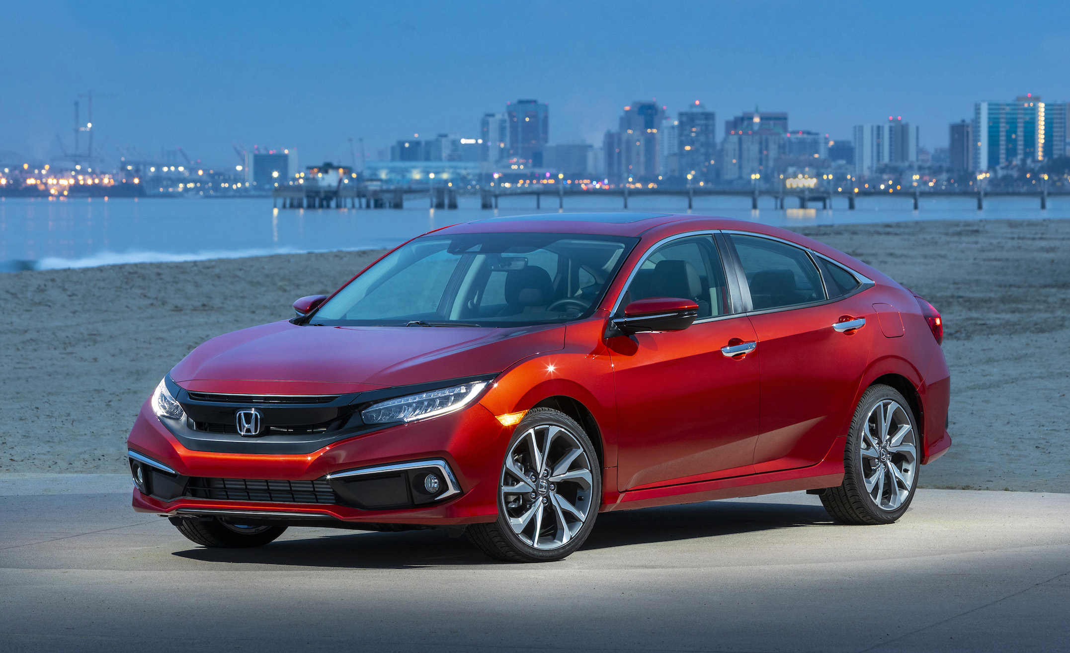 A red 2019 Honda Civic, a compact sedan.