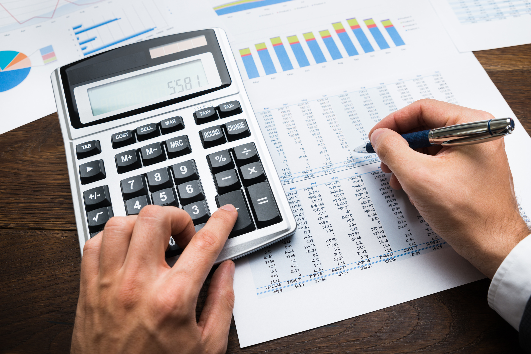 Businessman doing financial calculations on calculator