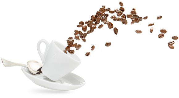 Coffee beans fly out of a cup.