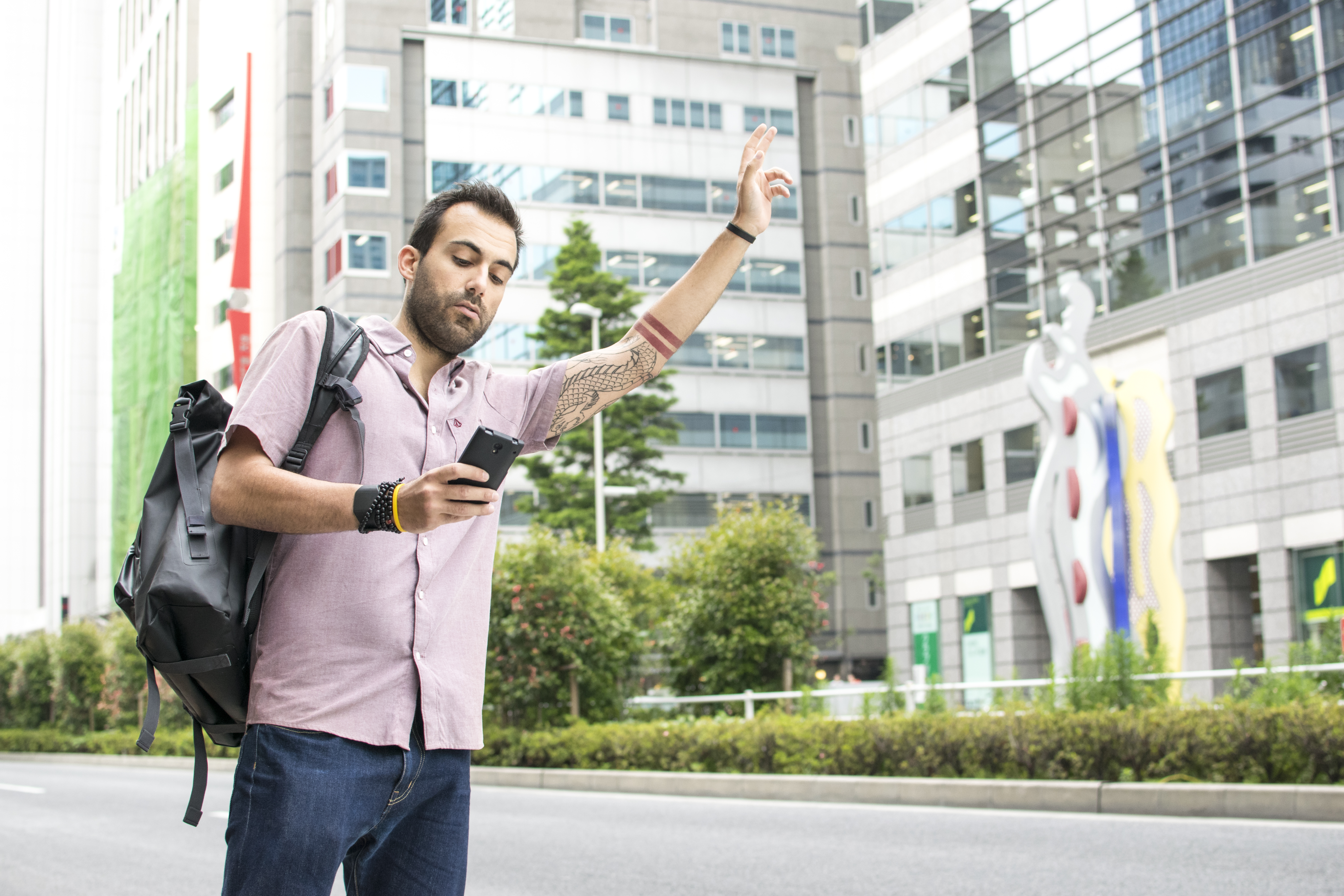 Person hailing a rideshare car