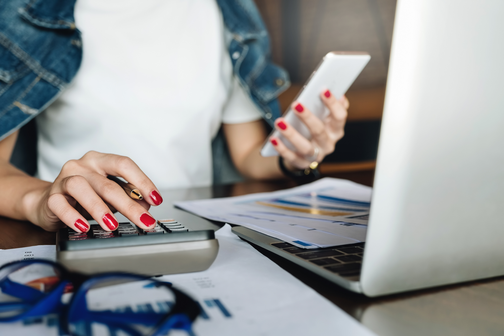 Woman adding up living expenses.