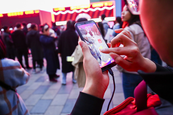 A person accessing an app on their smartphone.