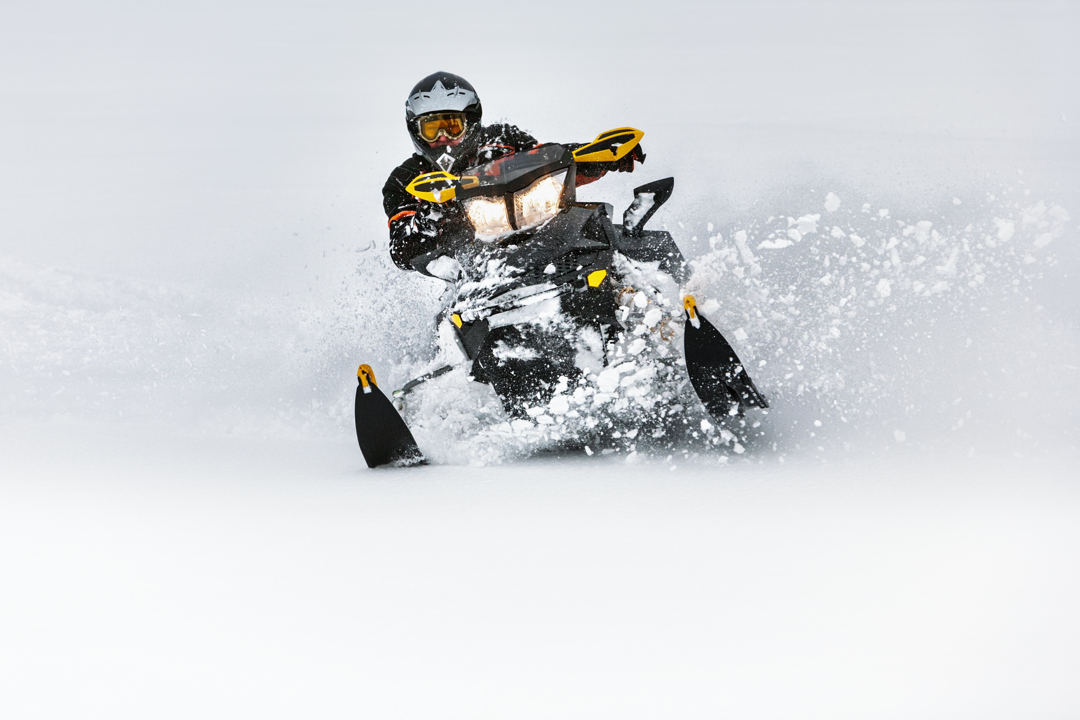 A person riding a snowmobile.