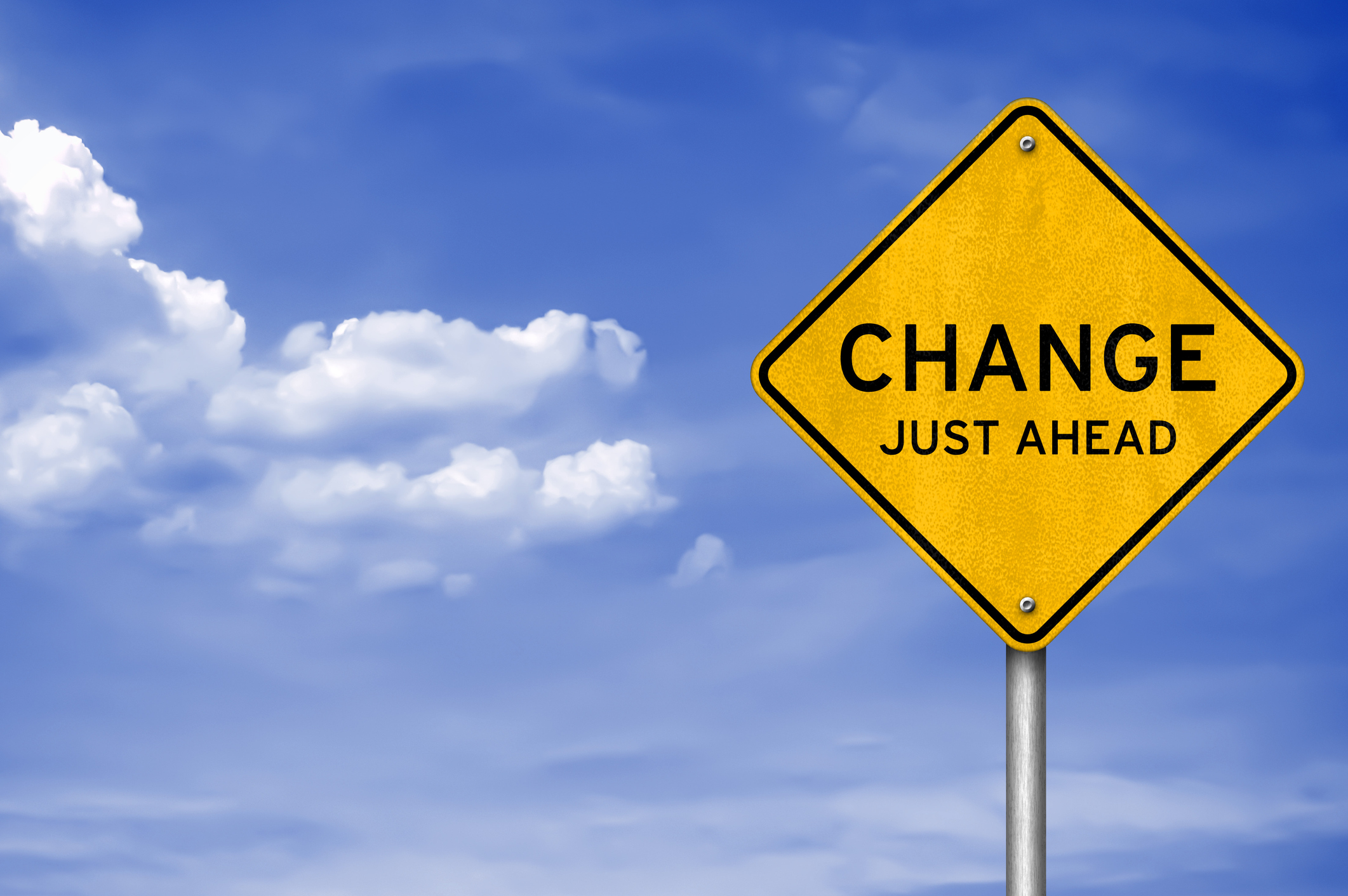A road sign that reads change just ahead.