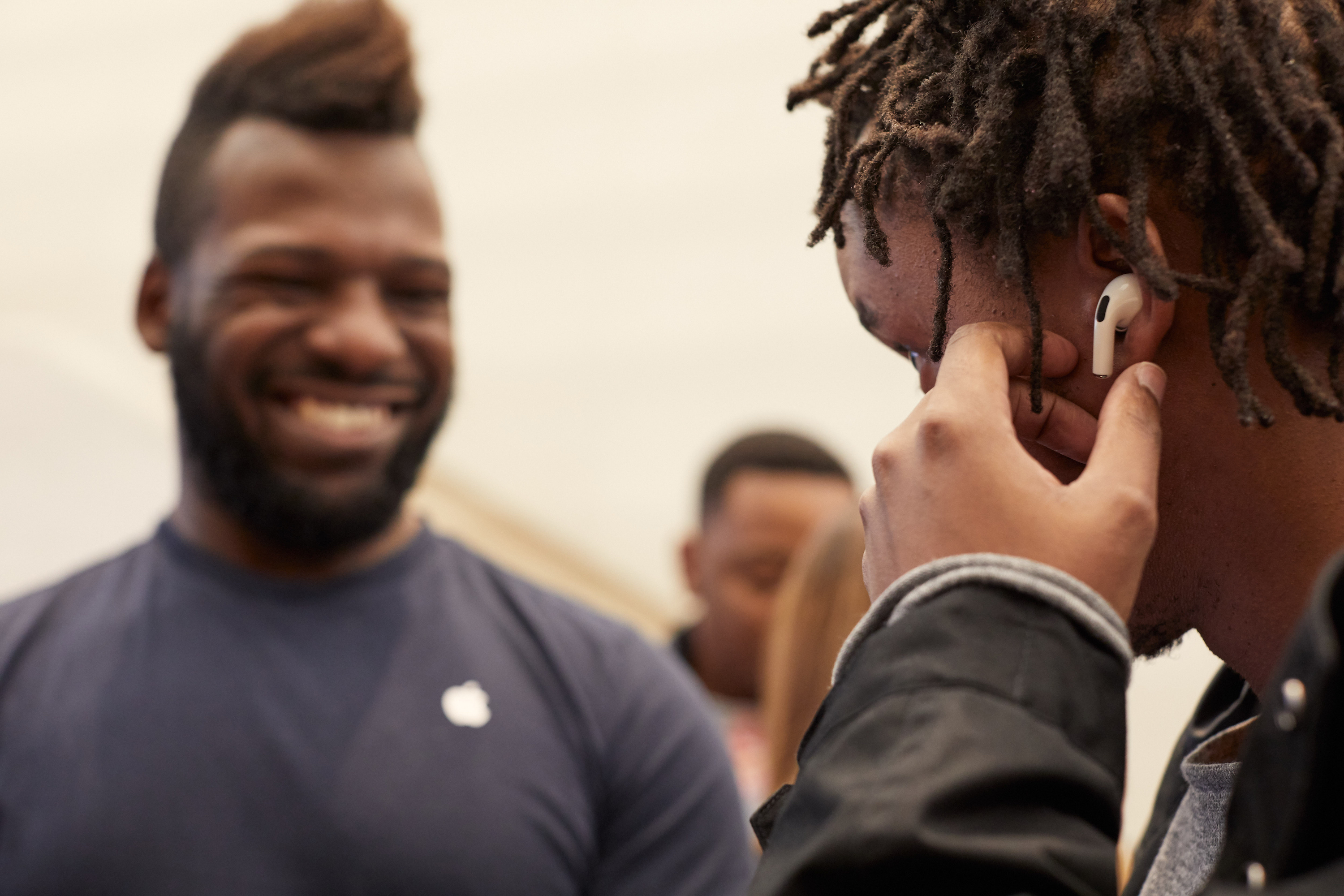 Customer trying on AirPods Pro