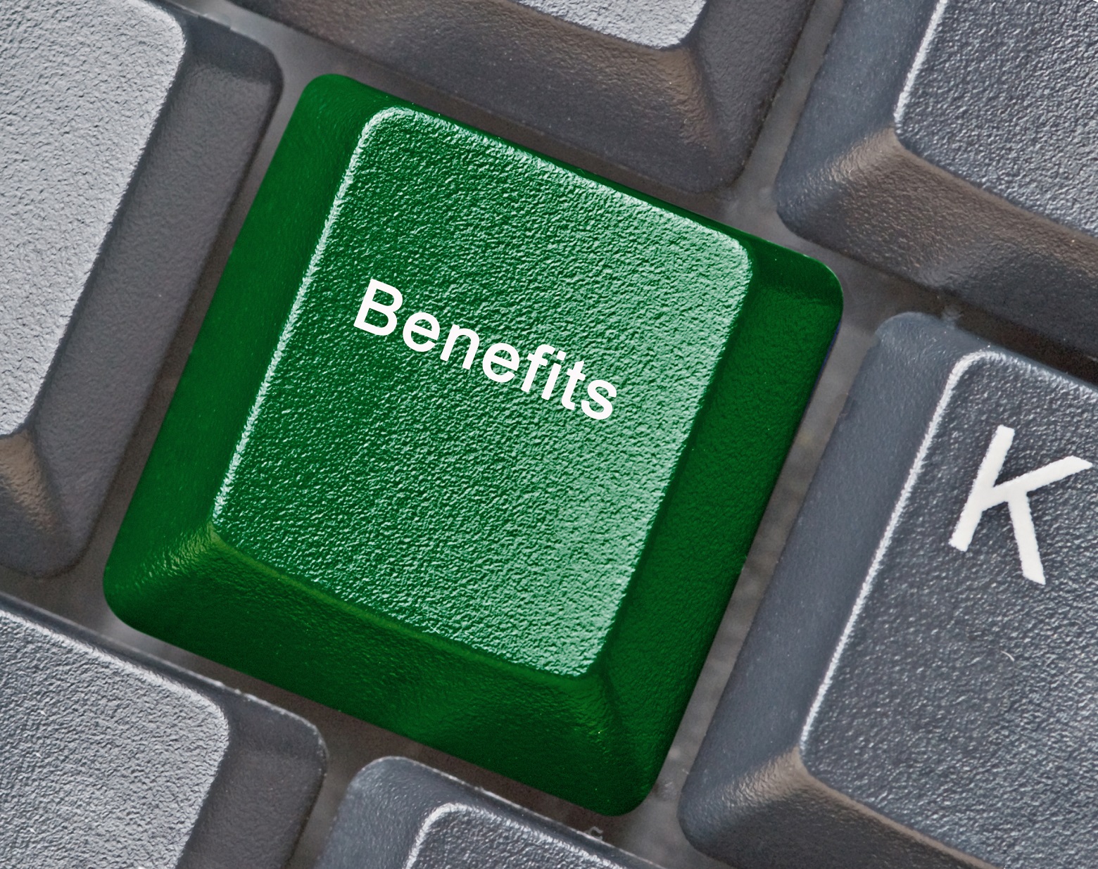 Keyboard with green benefits key.
