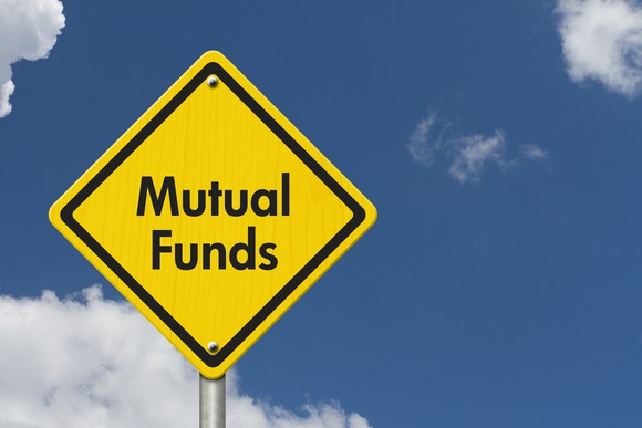 A yellow road sign that says mutual funds. 