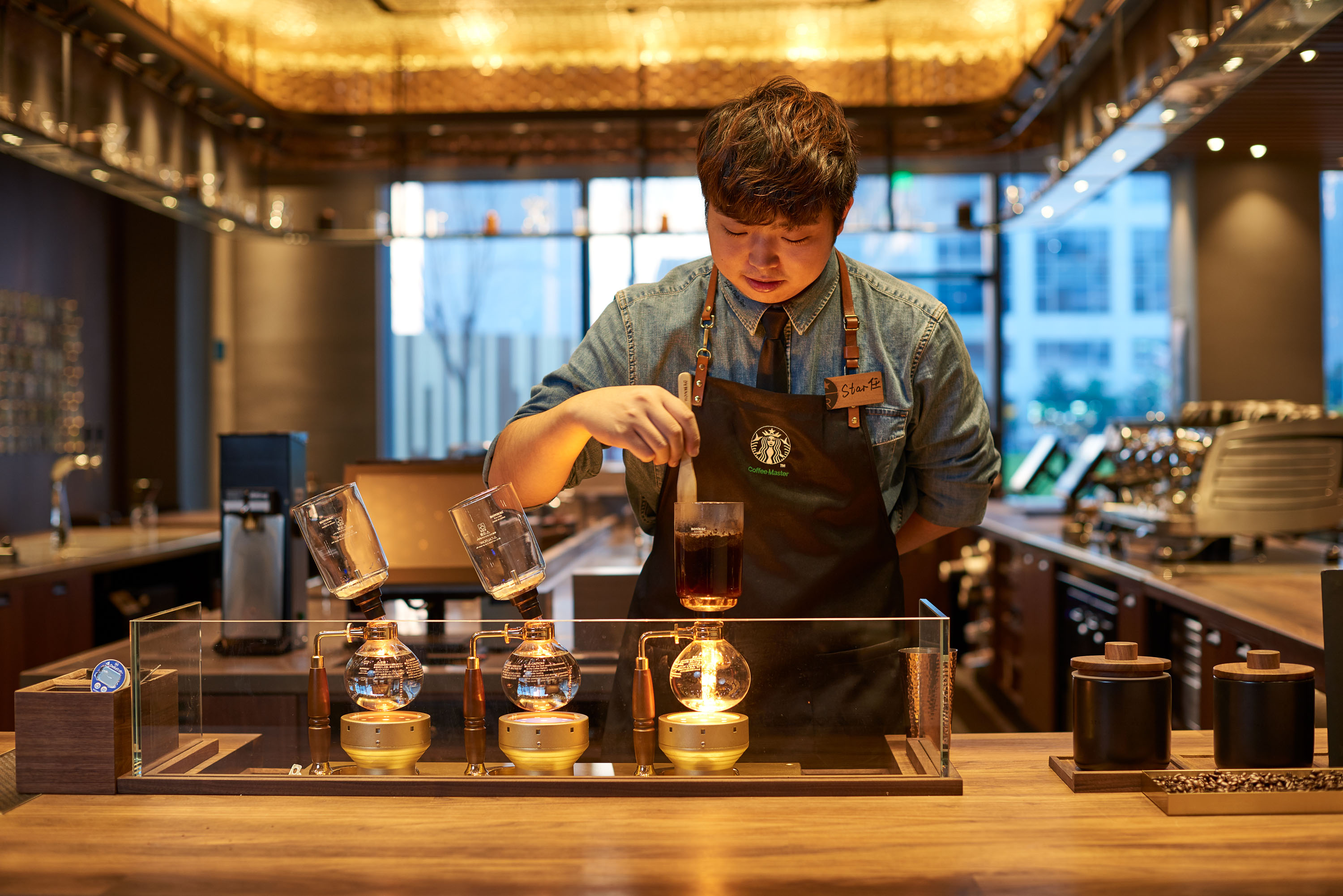 An employee working at a Starbucks store in China