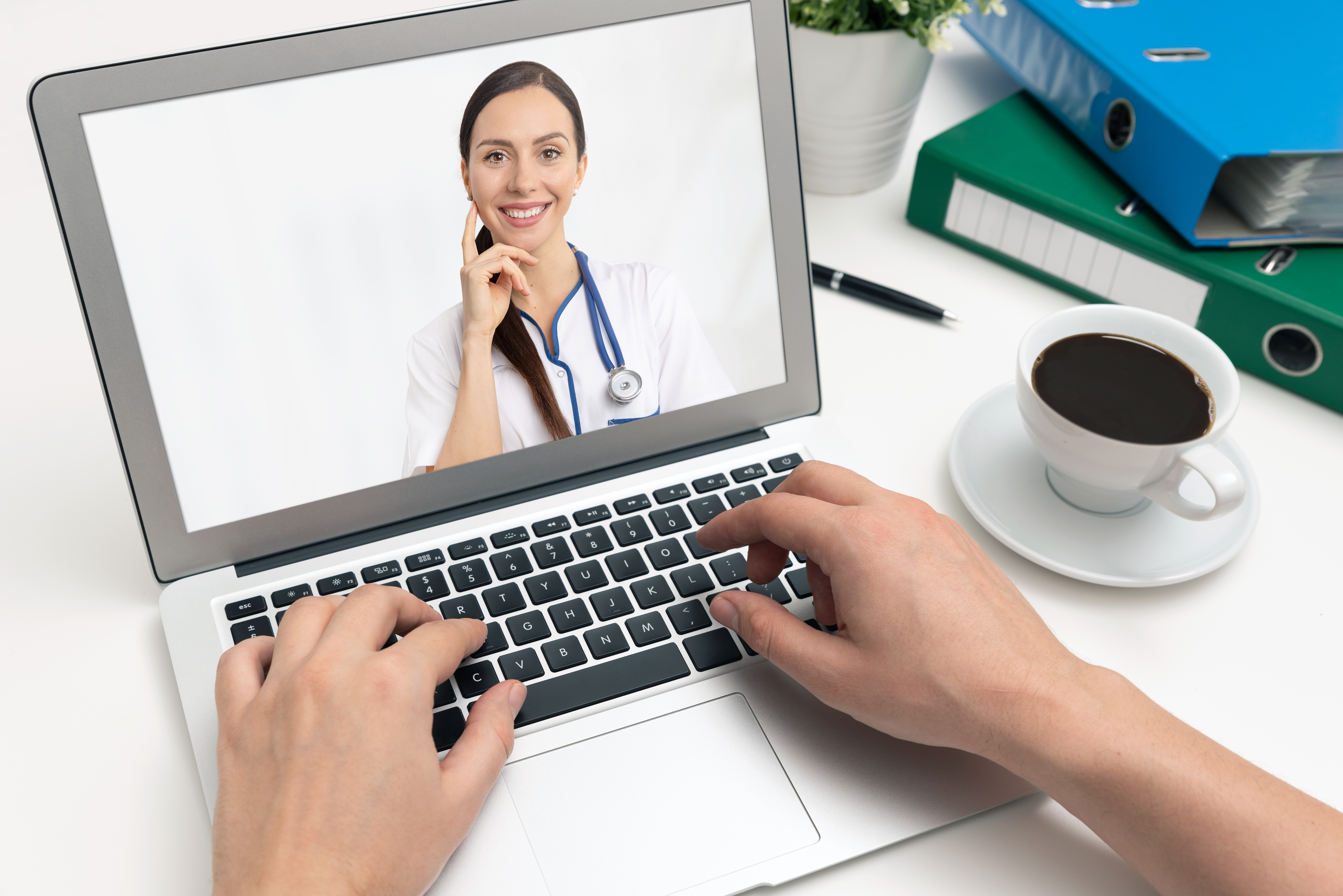 A doctor on a laptop screen demonstrating telehealth