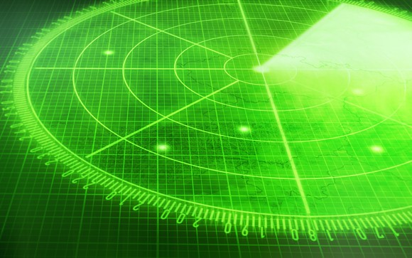 Green radar screen with multiple blips
