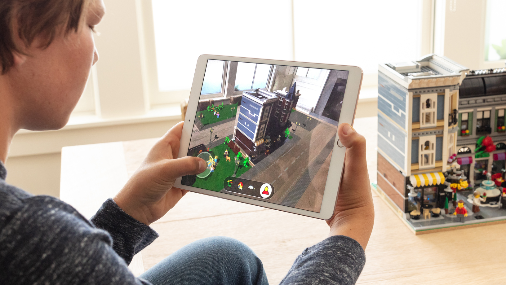 Kid playing an augmented reality game on an iPad